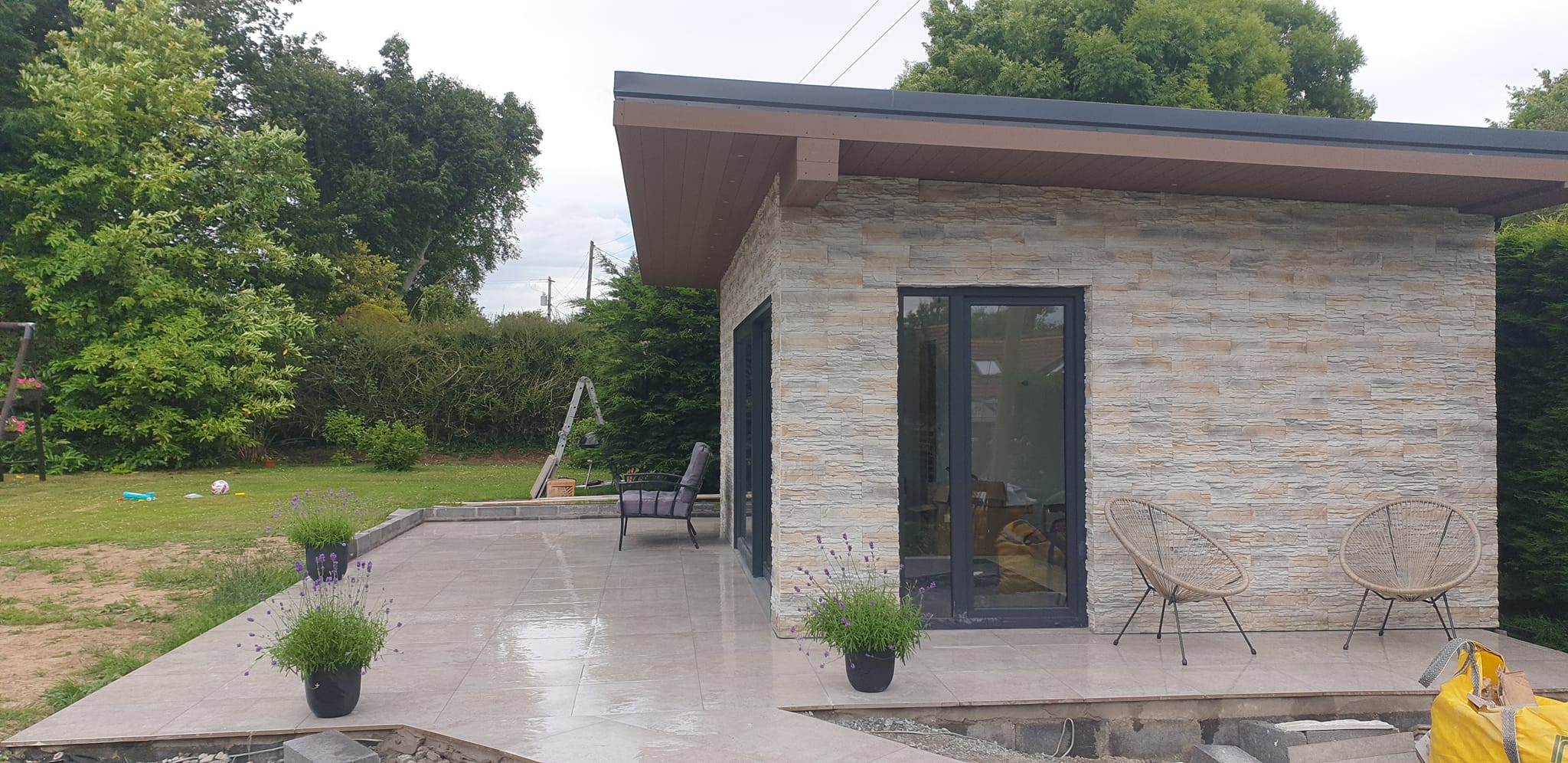 Modern Stone Garden Room with Patio